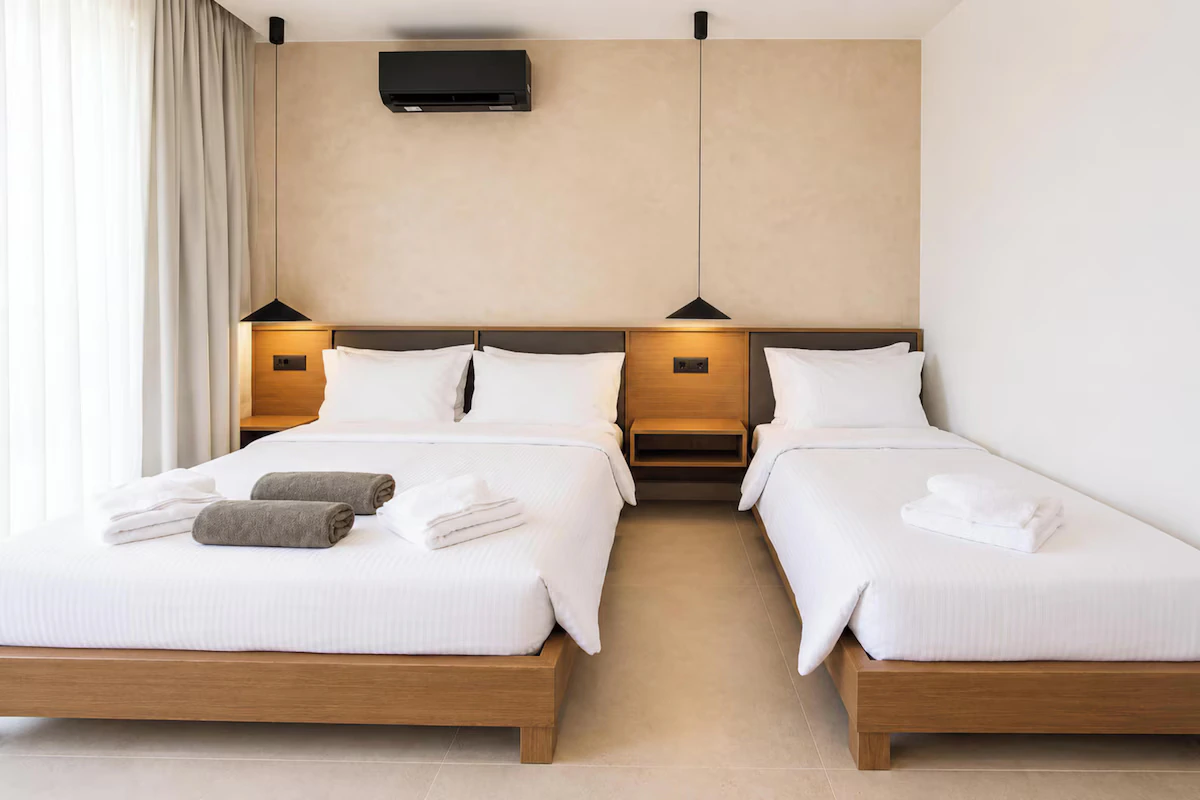 Double and single beds in the Standard Triple Studio at Eos Mare