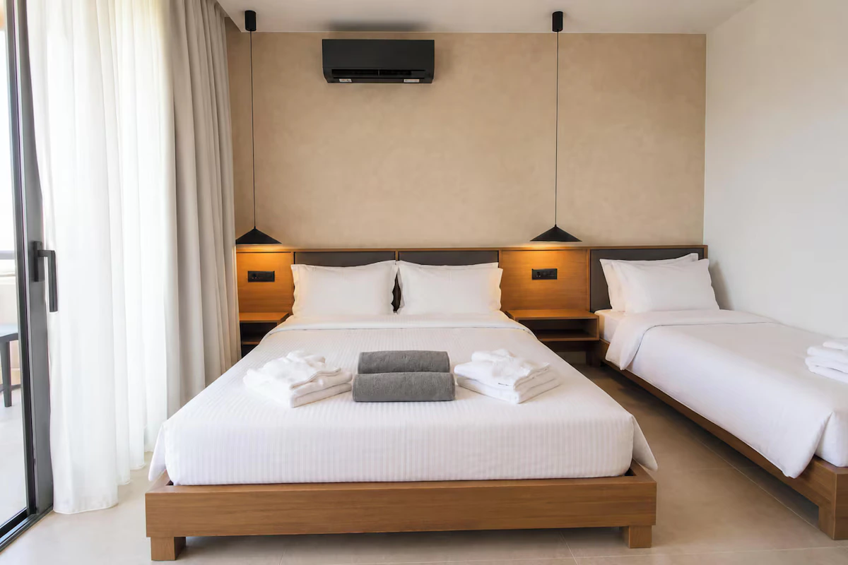 Double and single beds in the Triple Studio with Partial Sea View